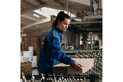 Woman working in paper plant.